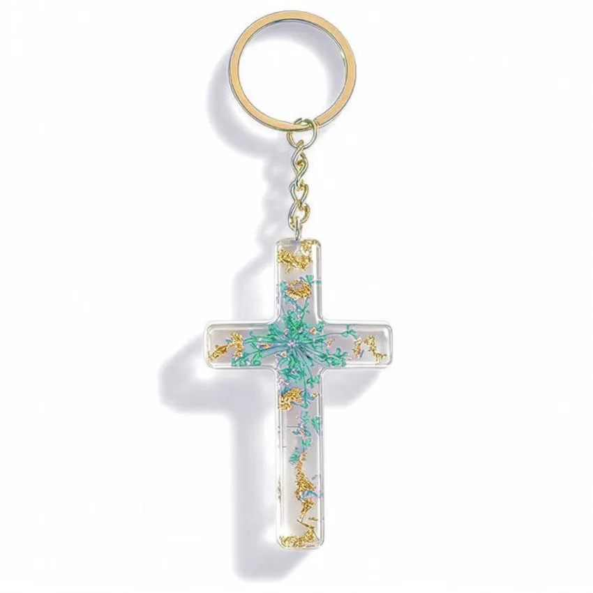 Porte-clé croix avec inclusions de fleurs - turquoise